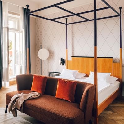 Bed in Deluxe Room with a Terrace at Falkensteiner Hotels