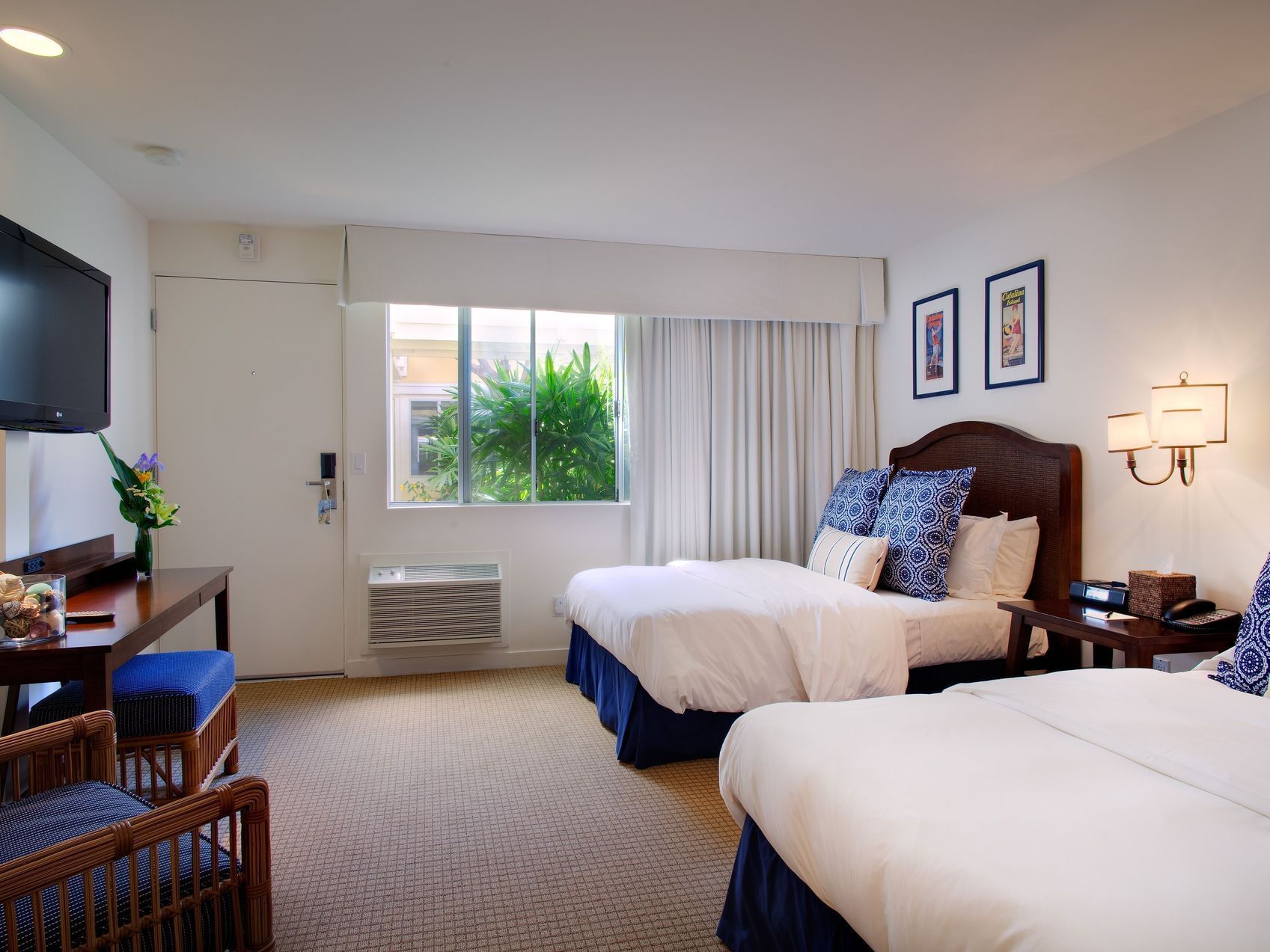 TV & dressing table facing the beds in Standard Double Room at Pavilion Hotel