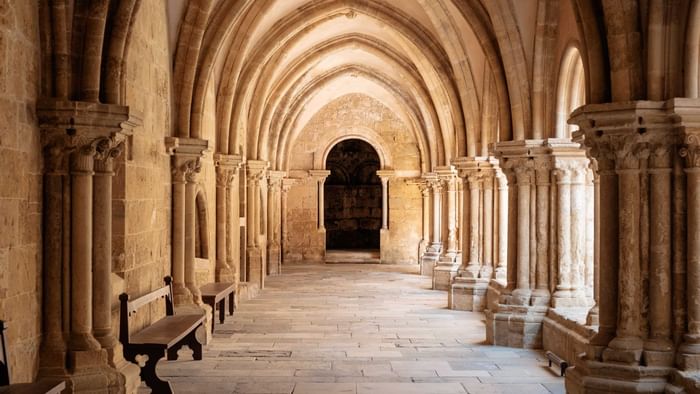 Corridor with benches in Mende near The Original Hotels