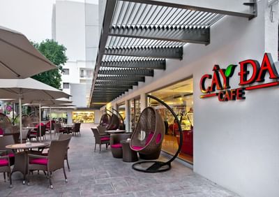 Outdoor dining area arranged in Cay Da Café at Eastin Grand Hotel Saigon