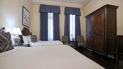 Twin beds & loungers in Junior Suite at Andrea Jackson Hotel