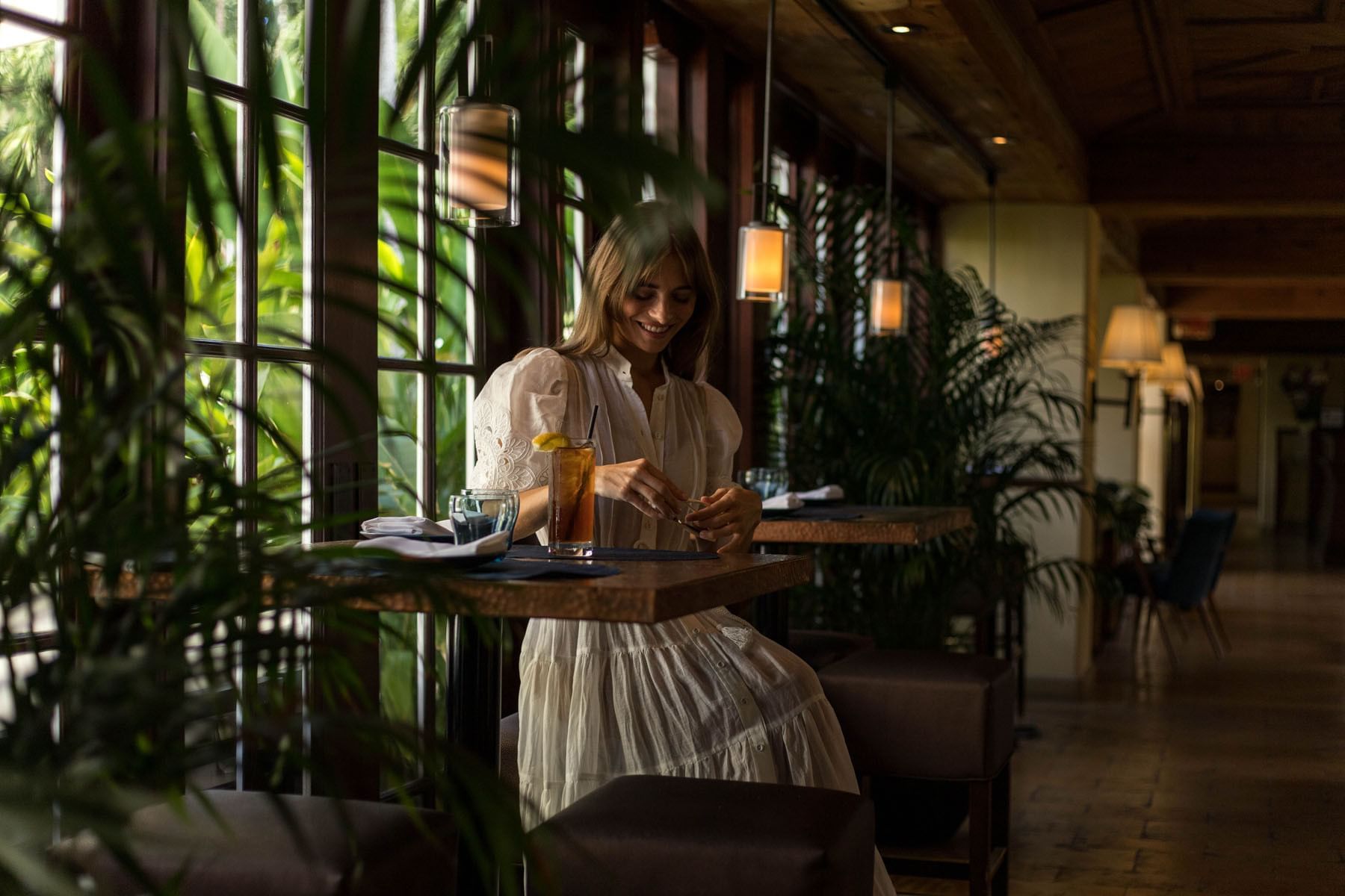 A woman dining in Café Boulud at Brazilian Court   