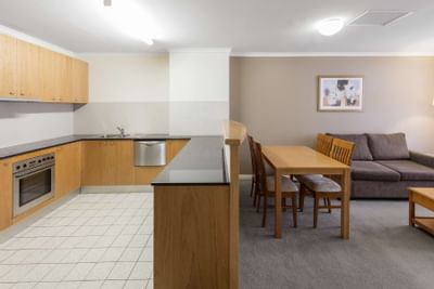 Kitchen & living area interior in a room at Nesuto Hotels