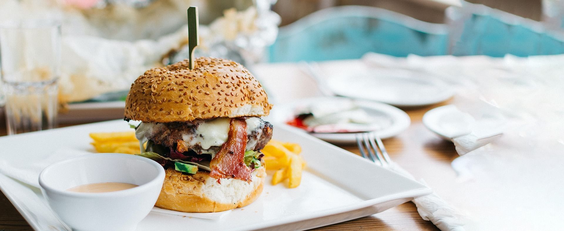 Close-up of a burger with sauce served at Amara Sanctuary