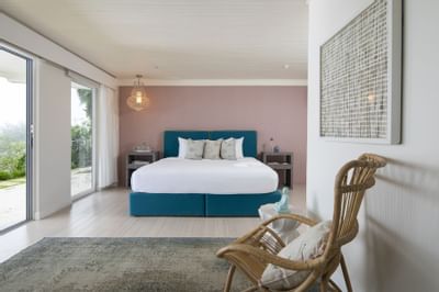 Bed & furniture in Deluxe room at Retreat Costa Rica