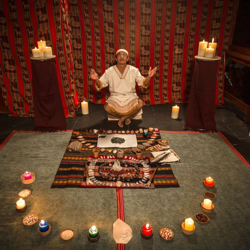 Priest performing Offering to pachamama rituals at Hotel Sumaq