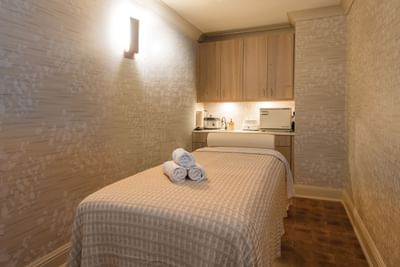 Treatment room at the tranquil spa, featuring a massage bed and soft lighting at The Abbey Inn & Spa