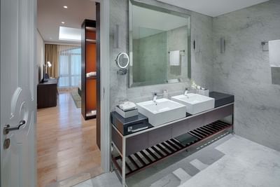 hotel bathroom with marble finishing and double sink