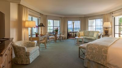 Luxurious Riviera Ocean View studio at Santa Barbara Inn with a cozy seating area, large windows, and elegant decor