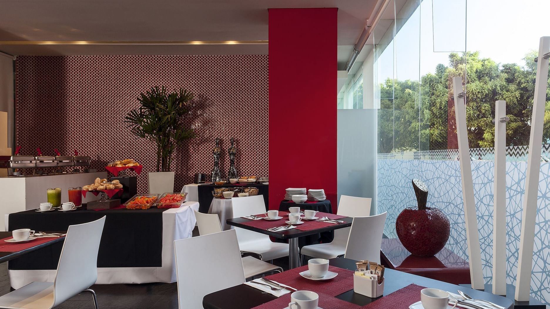 The dining area of a restaurant at Gamma Morelia Beló