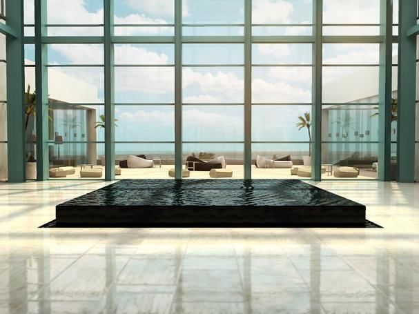 Lobby area with a glass door at Live Aqua Beach Resort Cancun