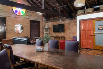 Dining table by the living area in Apartment 404 at Retro Suites Hotel