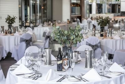 Banquet wedding tables & wine bottles at Amora Hotel Melbourne
