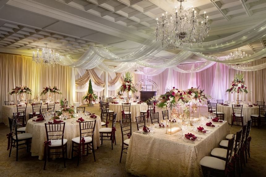 Decorated tables and chairs at a wedding in The Townsend Hotel