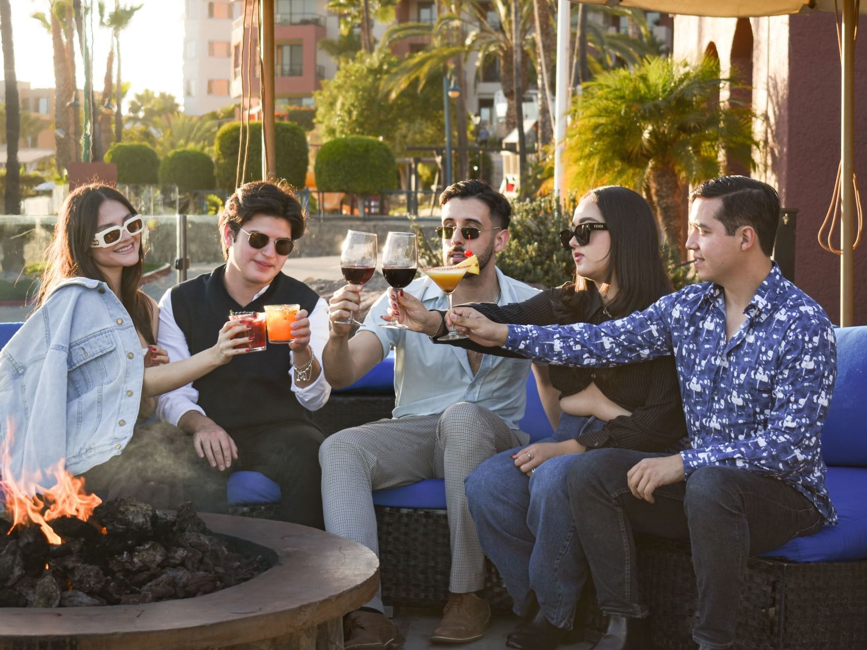 Friends toasting in Vineyard Tour at Hotel Coral y Marina