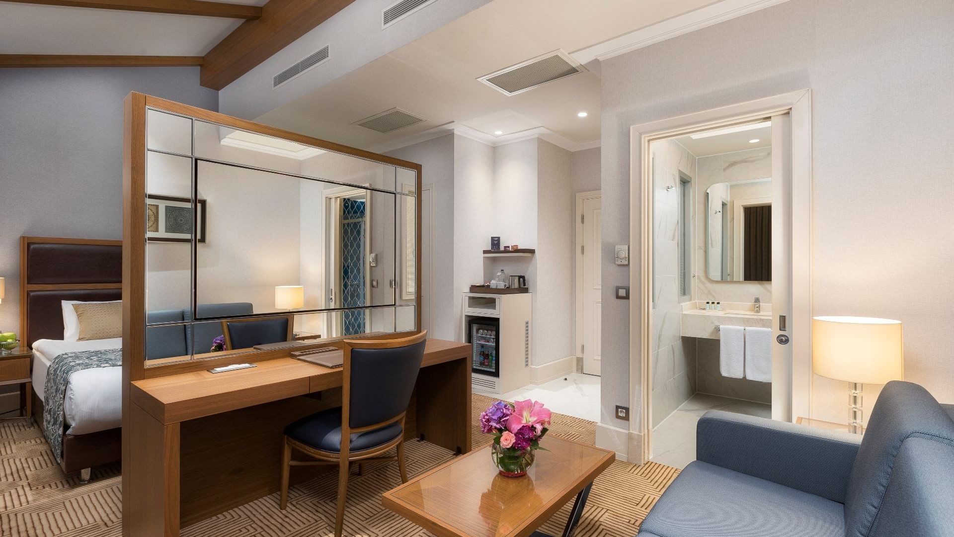 Working table with a mirror and sofa in the Executive Room at Titanic City Taksim