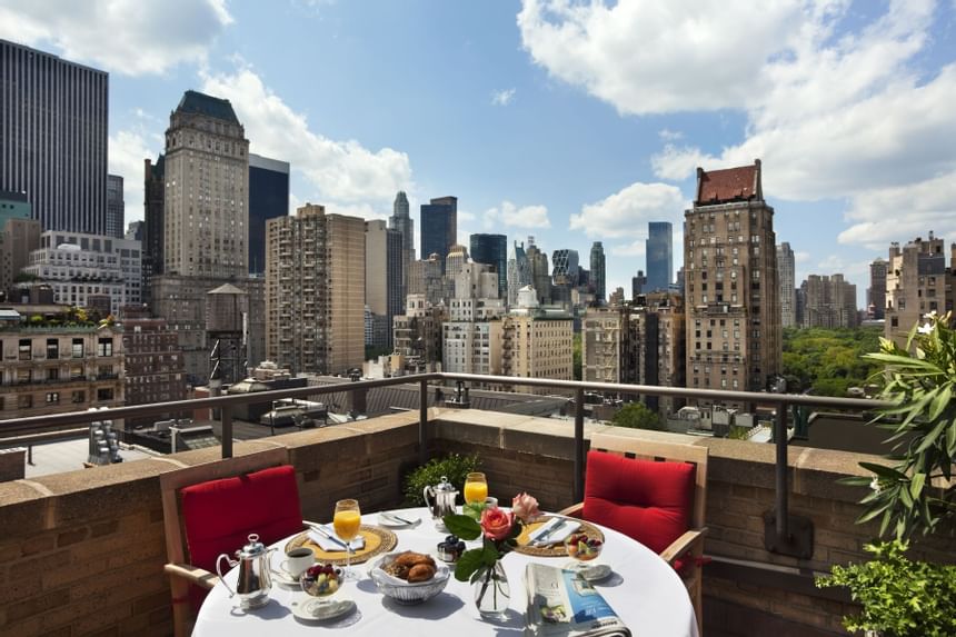 a table with breakfast on a balcony in New York City