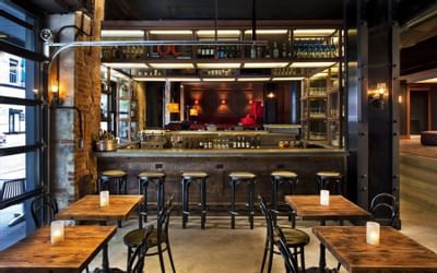 bar stools at an outdoor lobby bar