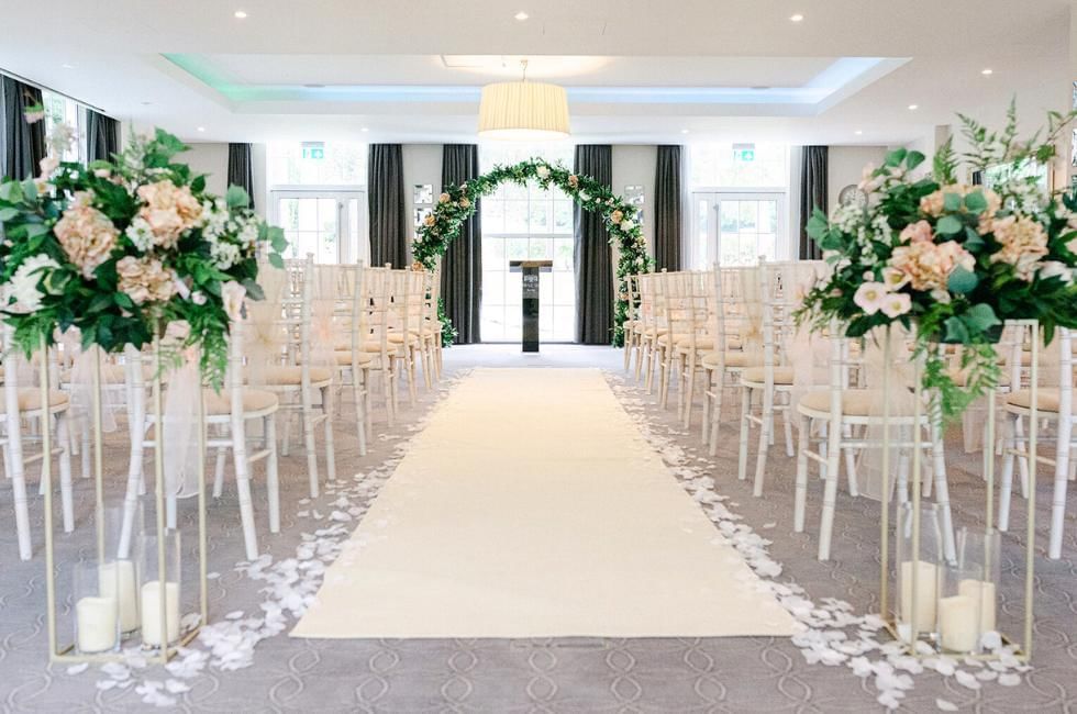 Indoor wedding ceremony inside Garden Suite at Gorse Hill one of the best Surrey Wedding Venues