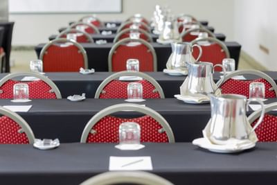 Classroom set-up with silver pitchers and glasses in Oppian at Hotel Los Delfines & Casino
