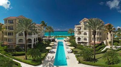 Distant view of the pool and the hotel at Somerset On Grace Bay