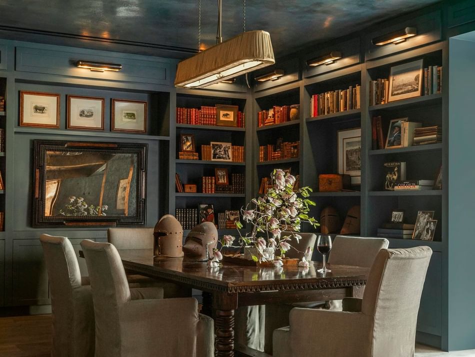 Cozy dining area in The Granduca Library at Granduca Houston, one of the classy restaurants in Houston, with bookshelves