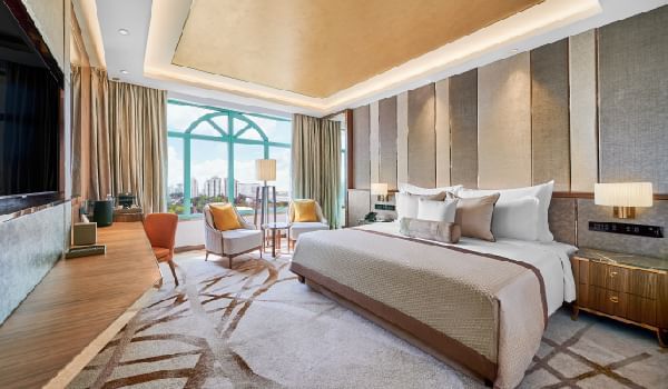 King bed, chairs & desk in Club Room at Sunway Resort