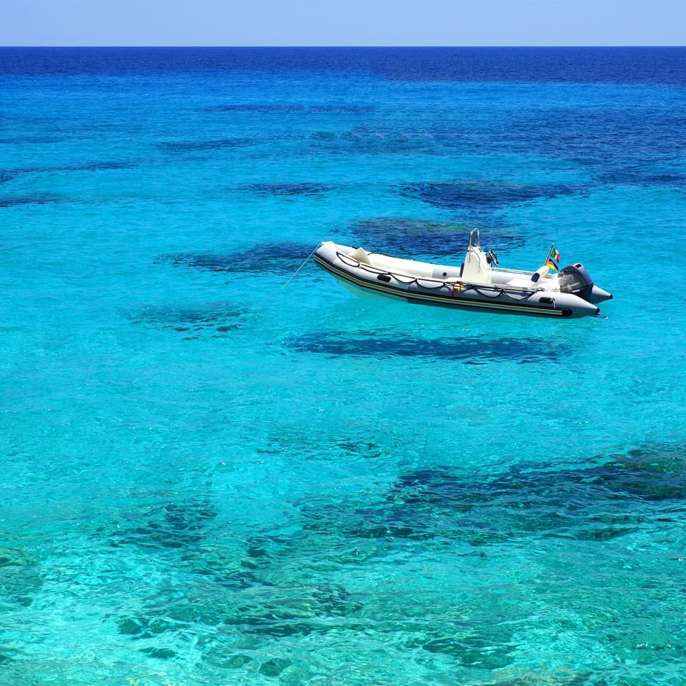 A dinghy boat on the sea near Falkensteiner Hotels