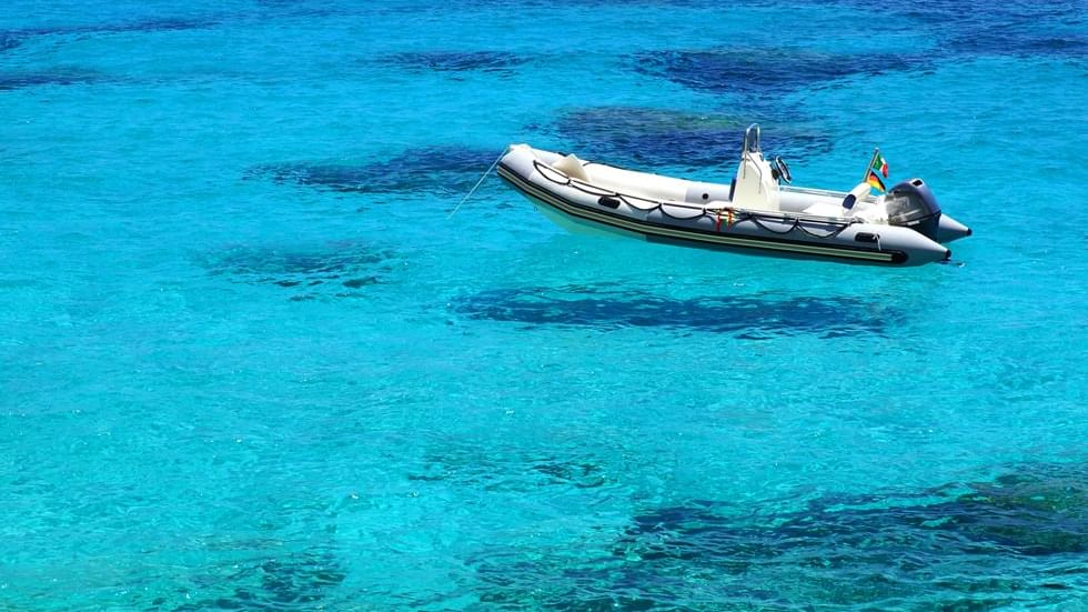 A dinghy boat on the sea near Falkensteiner Hotels