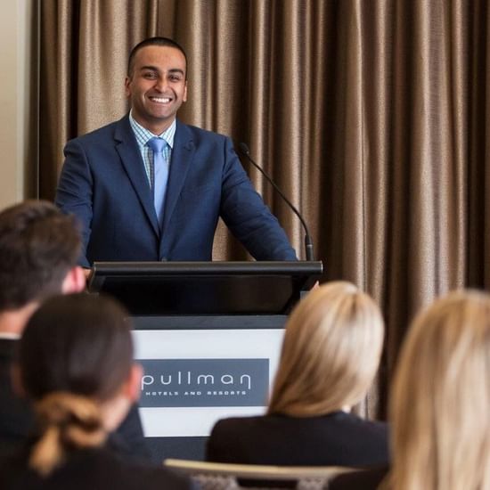 Man hosting a Meeting for an audience at Pullman Olympic Park