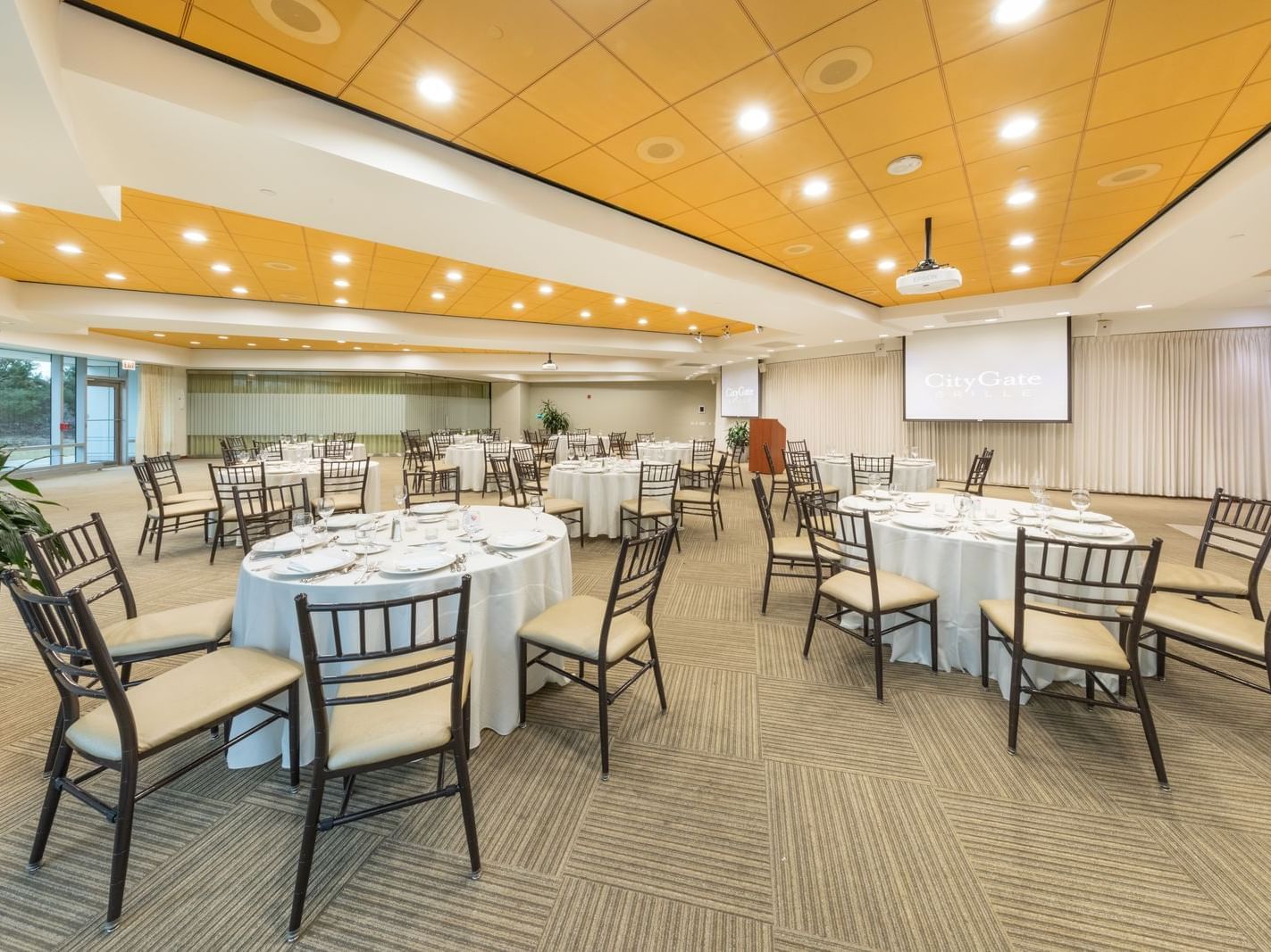 Terrace Room event space with tables and chairs at Hotel Arista in Naperville.