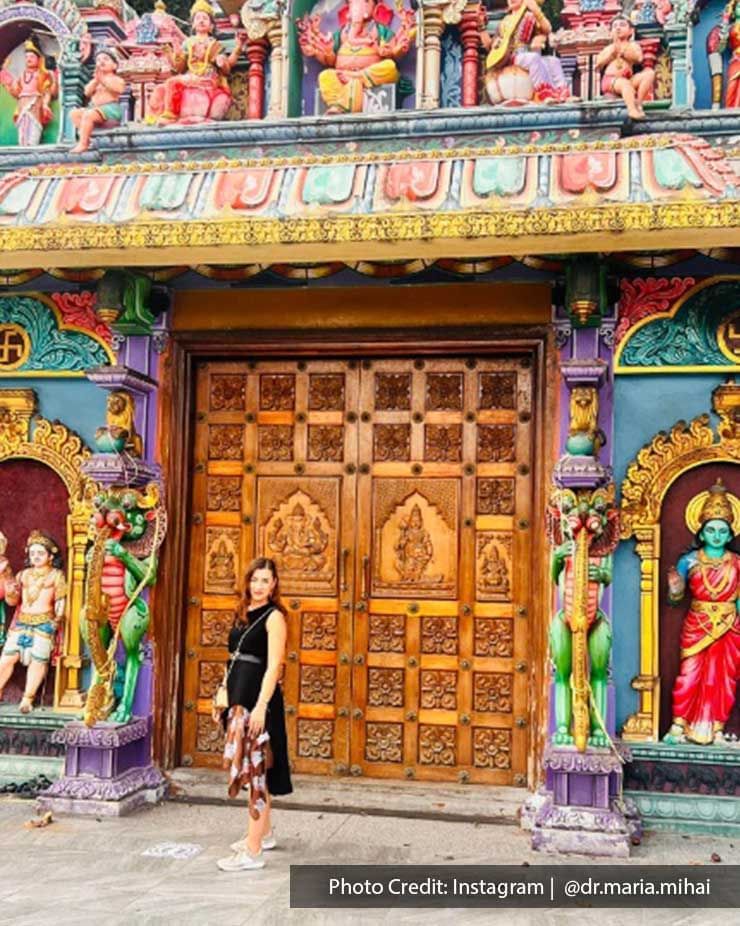 Lady posing by the entrance at Batu Caves, a famous attraction near Imperial Lexis Kuala Lumpur