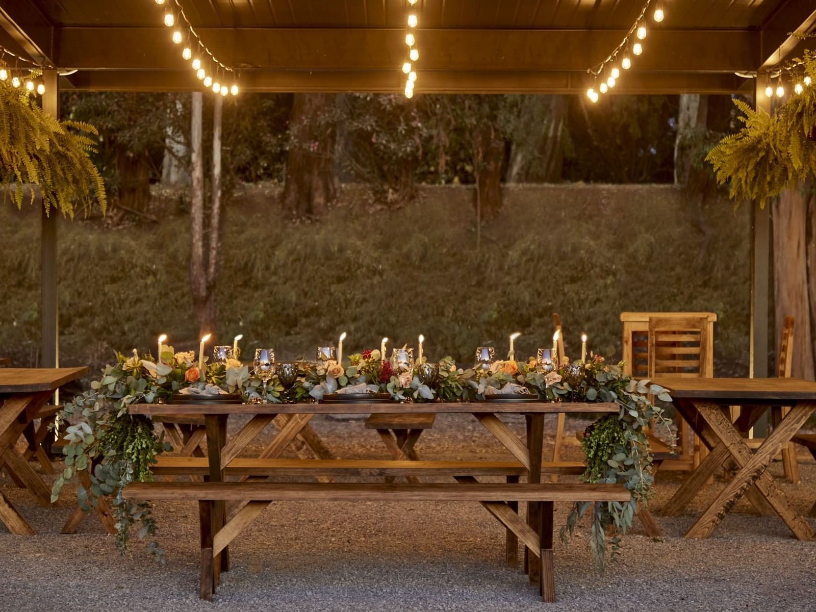 Outdoor picnic table in La Terraza with candles at La Colección