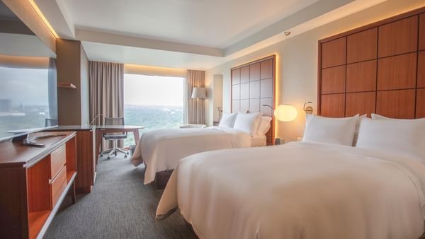 Deluxe Room with 2 beds and furniture at Grand Fiesta Americana