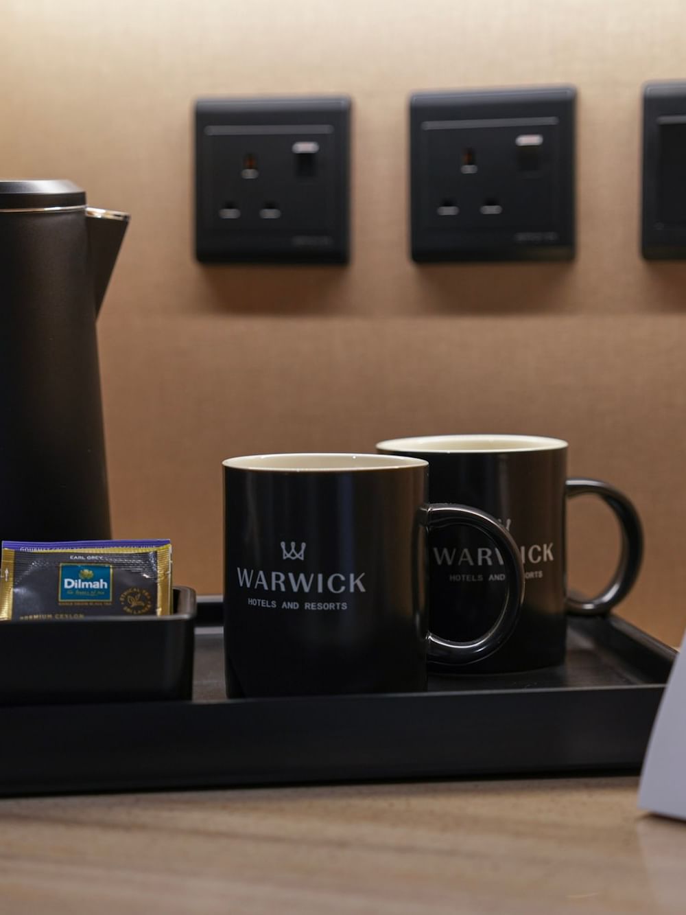 Coffee station with kettle and mugs in Junior Suite at Warwick Hotel & Spa Jeddah.