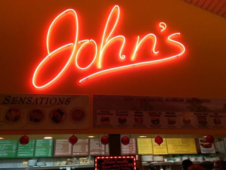 Neon sign of John Restaurant at 7 Springs Inn & Suites