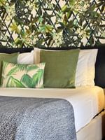 Lagoon Superior Room with tropical theme decor and a bed at Warwick Le Lagon - Vanuatu in Efate.