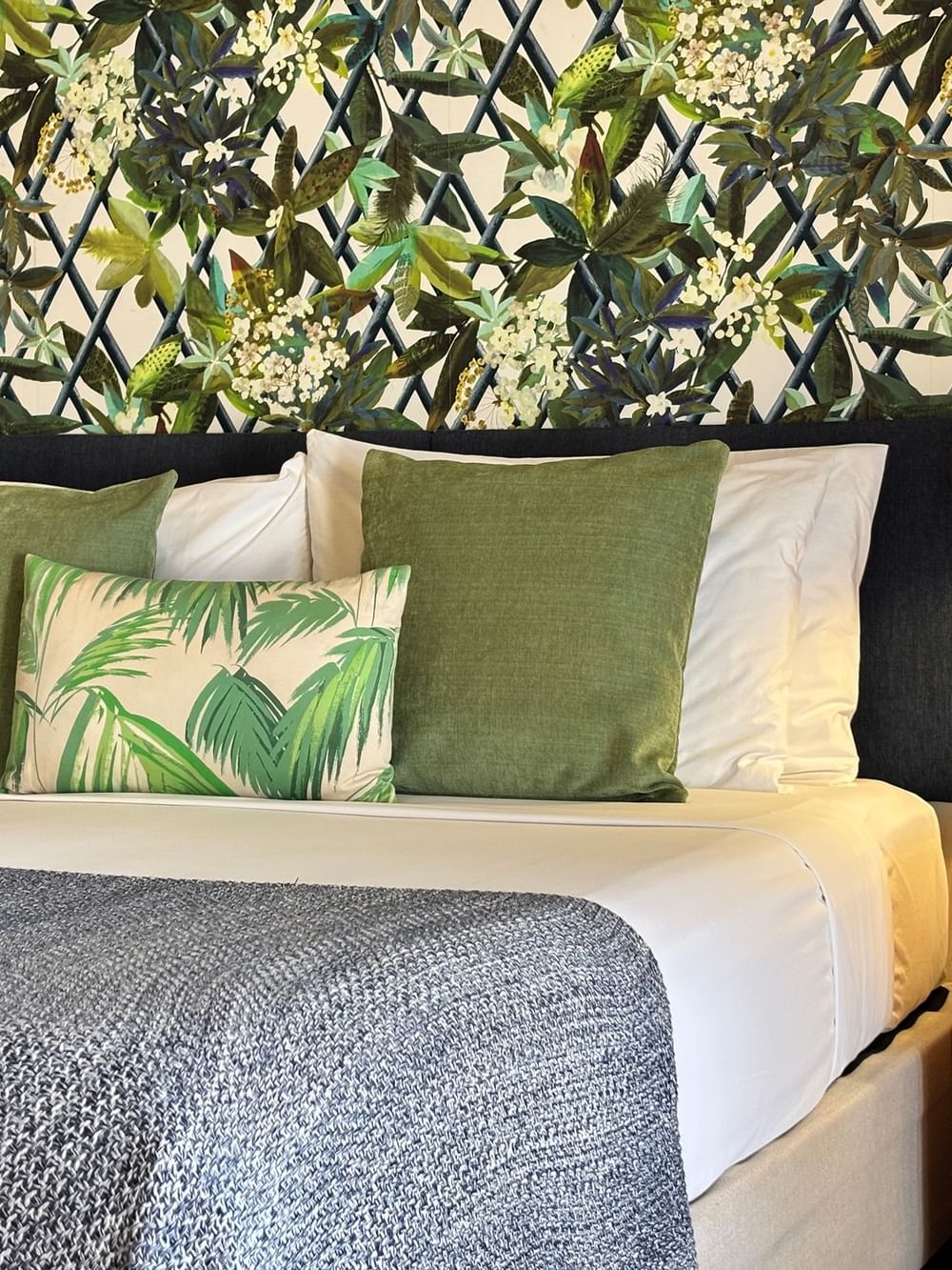 Lagoon Superior Room with tropical theme decor and a bed at Warwick Le Lagon - Vanuatu in Efate.