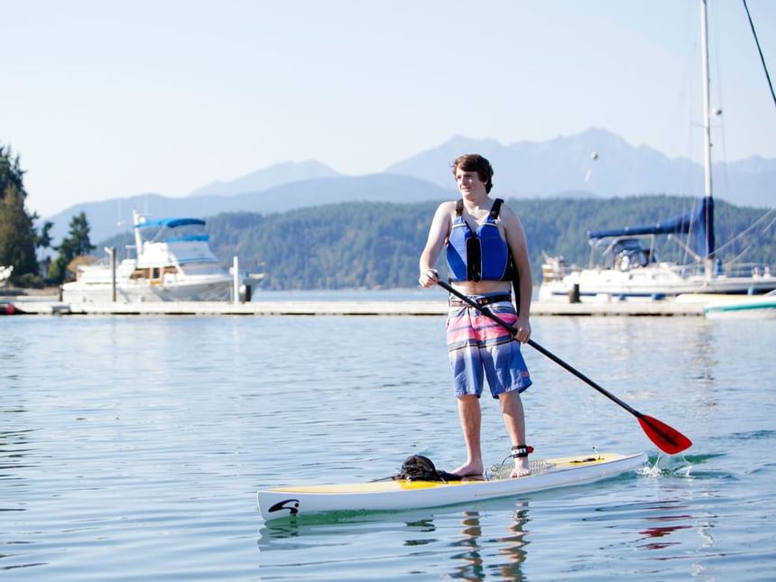 A man on a SUP at Alderbrook Resort & Spa