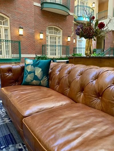Leather couches in the renovated atrium at Hotel at Old Town