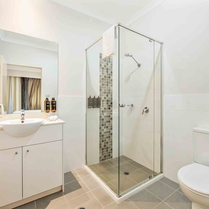 Bathroom with white vanity, basin, and glass shower partition in Two Bedroom Apartment at Mercure Kooindah Waters