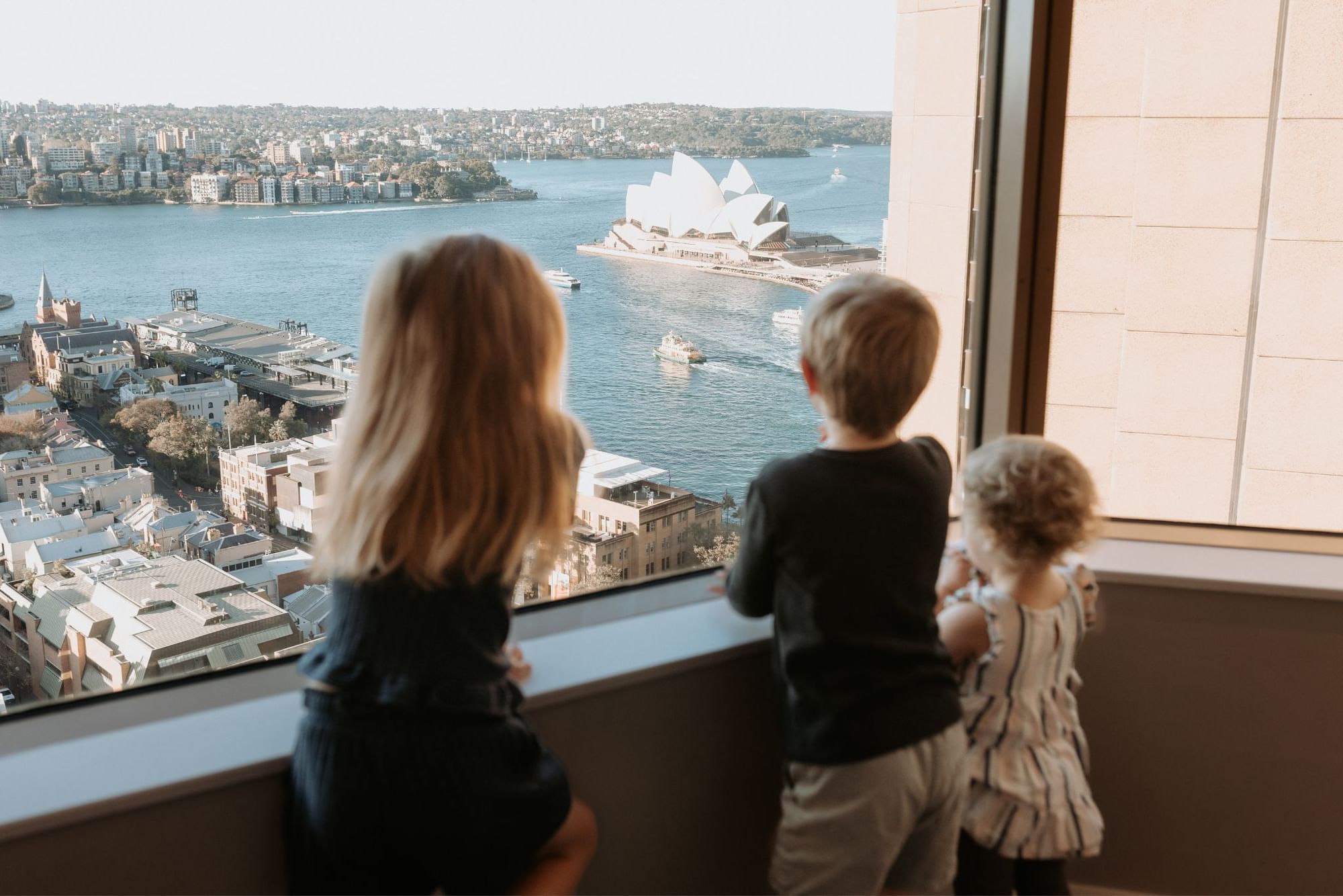 Kids Looking at the Window | Sebel Quay West Suites Sydney