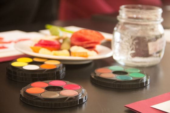Watercolors with a jar of water at Cradle Mountain Hotel