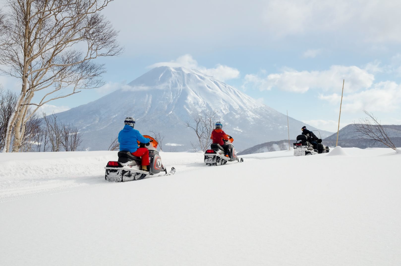 People snowmobiling near Chatrium Hotels & Residences