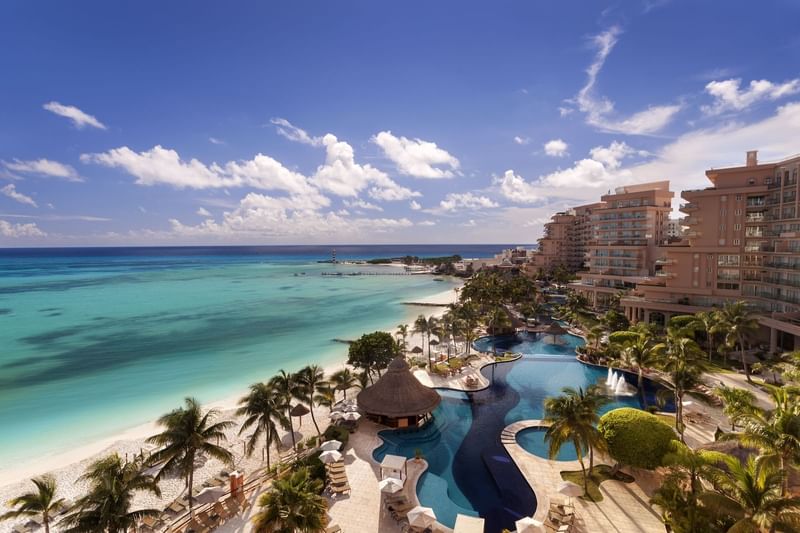 Elevated view of pool area with sun loungers in hotel Grand Fiesta Americana Coral Beach Cancún