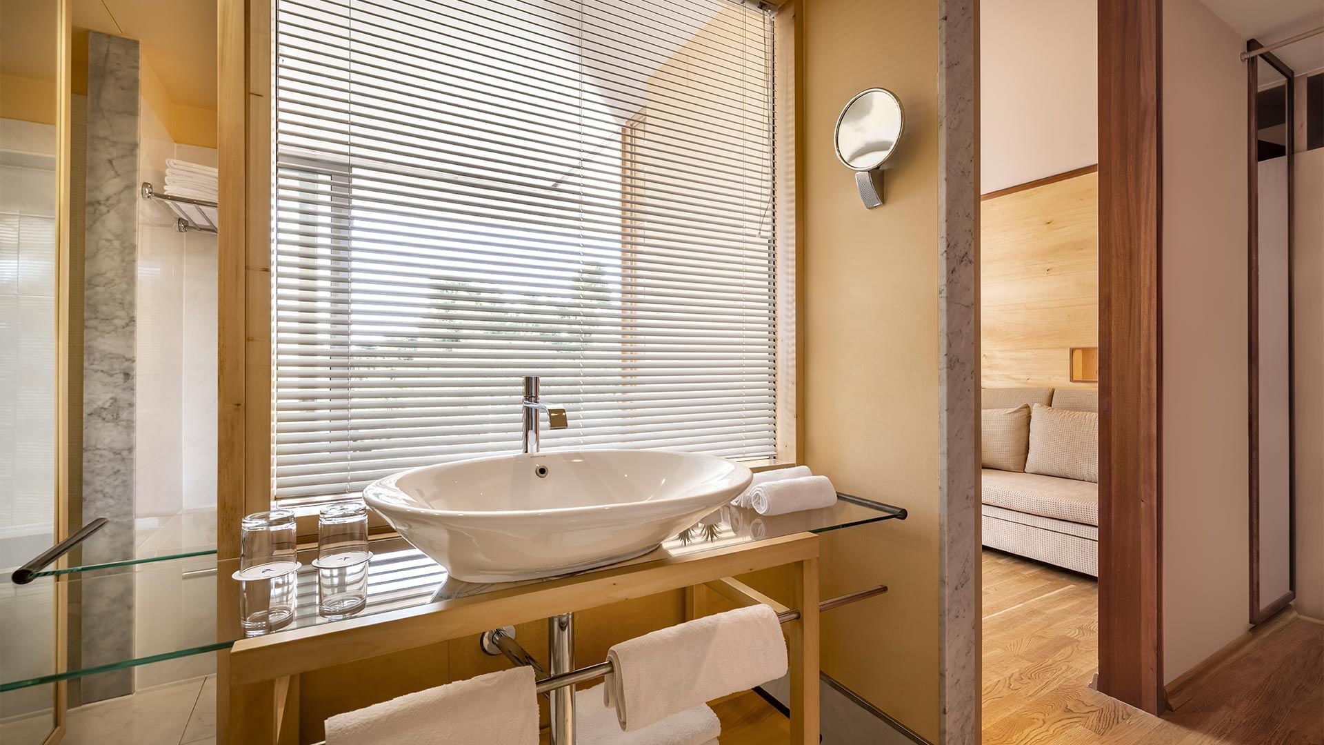 Bathroom vanity area in Comfort Room at Falkensteiner Hotels