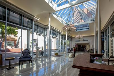 Lobby with skylights and check-in desk at Horton Grand Hotel