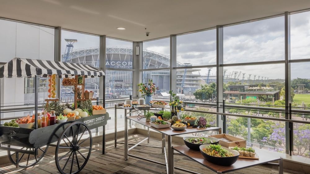 Fruit and vegetable display cart near large windows at the Residential Conference in Novotel Sydney Olympic Park