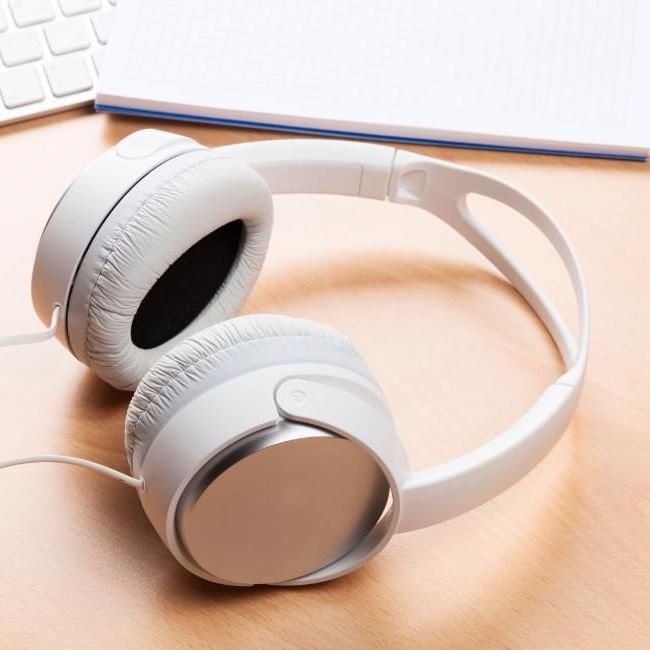 Headphones on desk as employer is trying out to see the benefits of music in the workplace