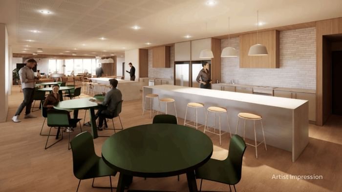 People dining in a modern communal kitchen and dining area at UniLodge Brisbane City in Brisbane City.